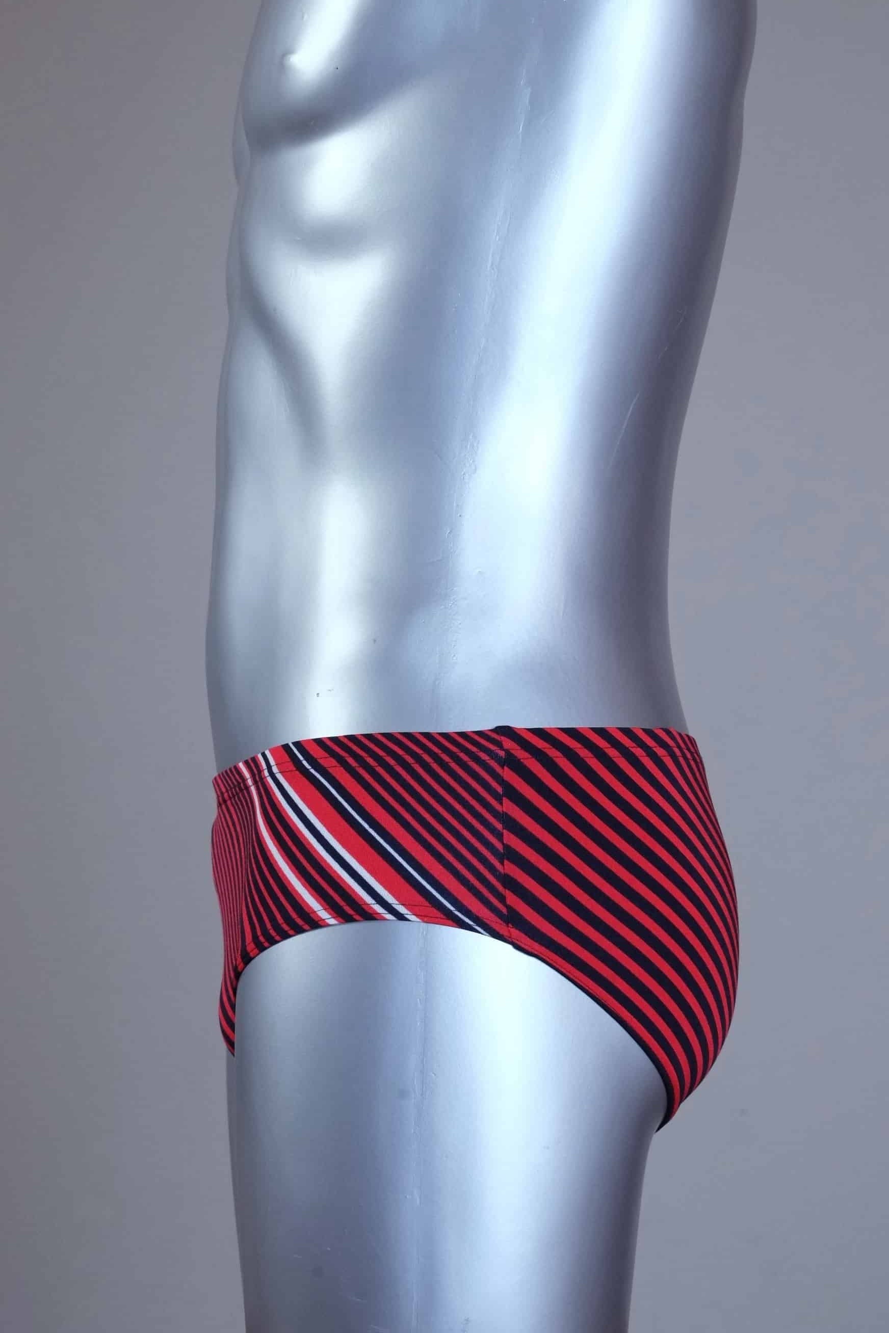 Side view of red striped men's Solar swim briefs on a silver mannequin against a gray background