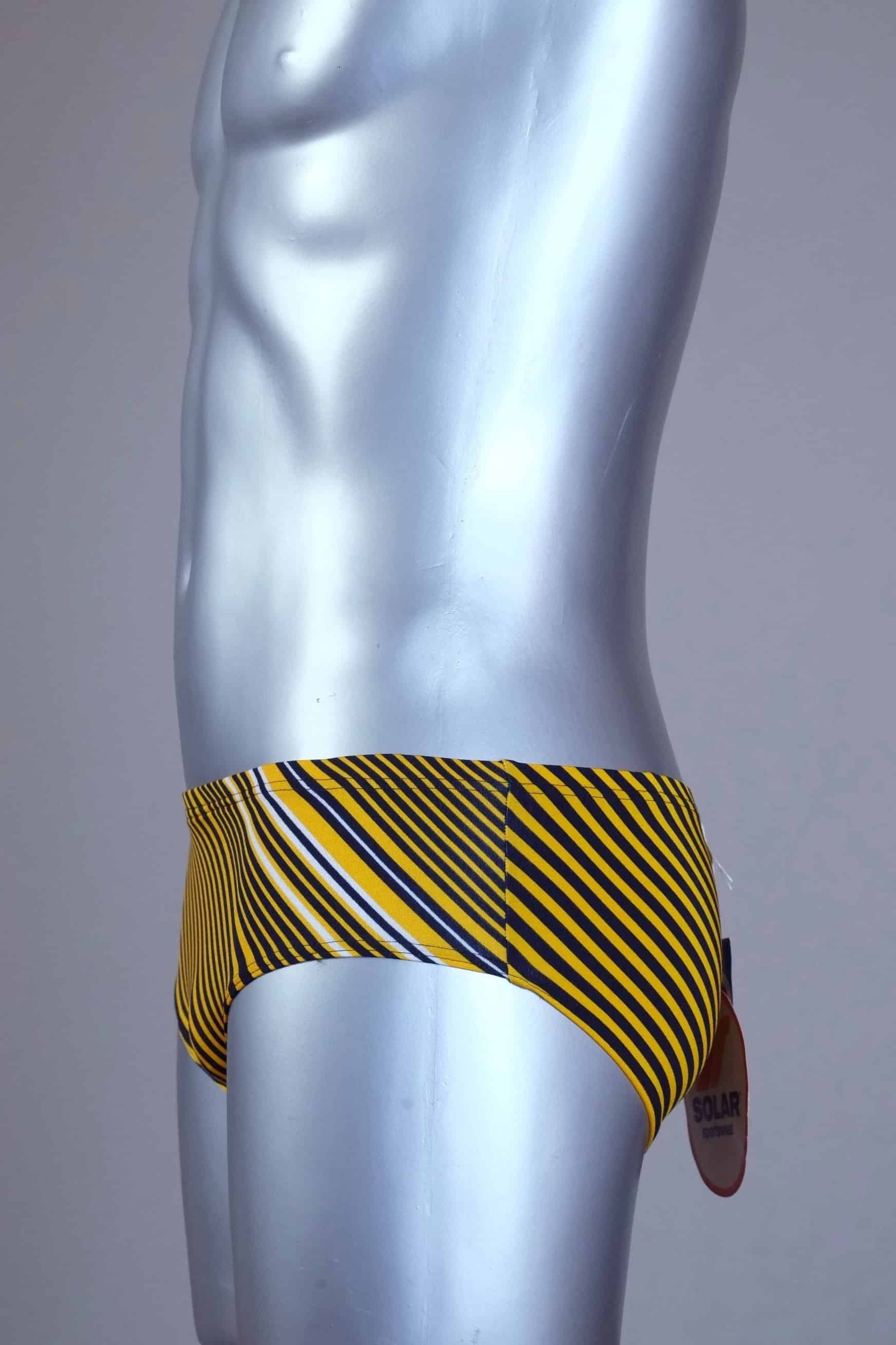 Side view of yellow striped men's Solar swim briefs on a silver mannequin against a gray background