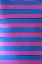 Close-up of Solar vintage 80s ribbed cotton fabric — wide bold horizontal stripes in pink and blue with narrow red and navy accent lines, texture detail.