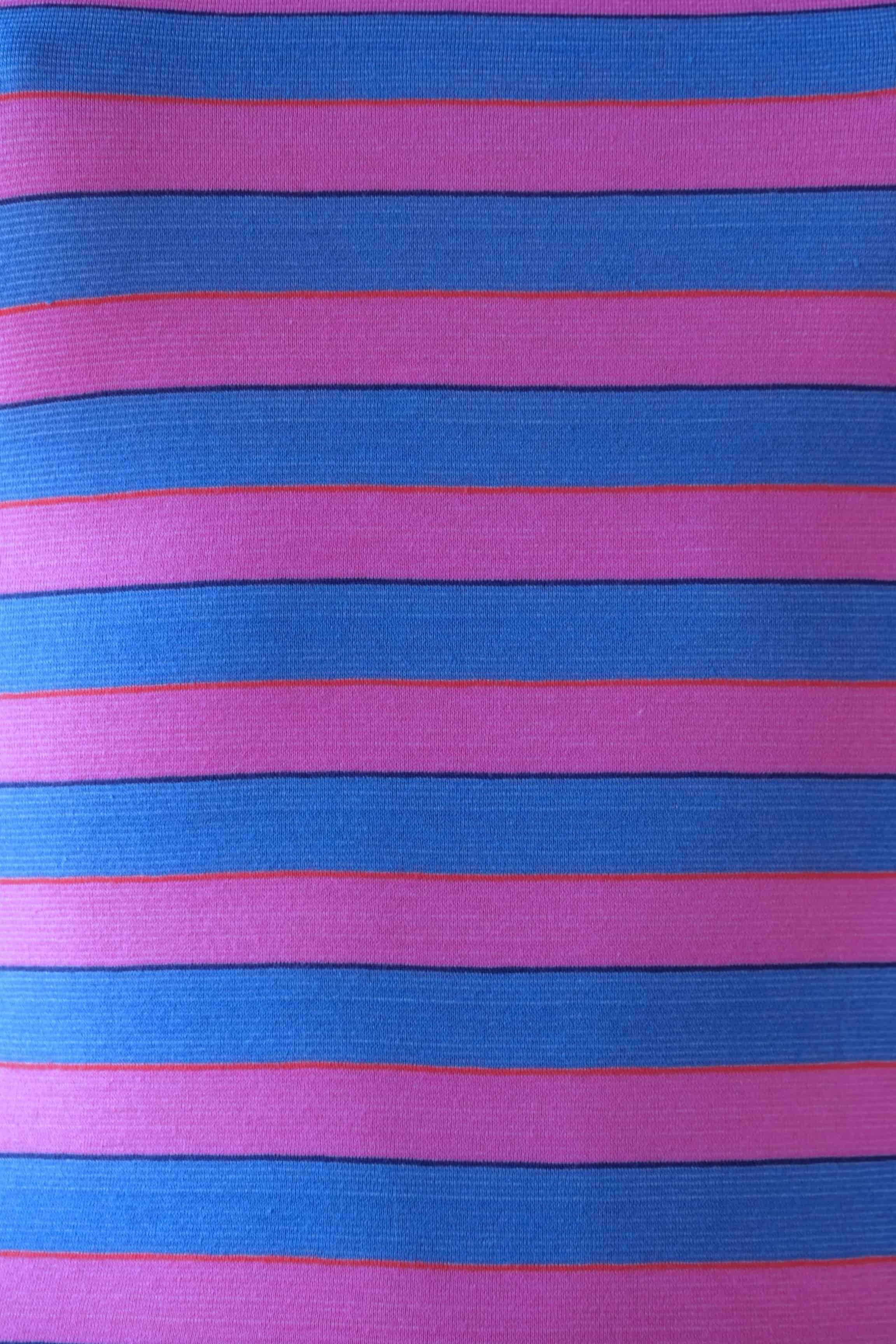 Close-up of Solar vintage 80s ribbed cotton fabric — wide bold horizontal stripes in pink and blue with narrow red and navy accent lines, texture detail.