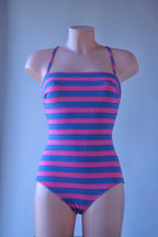 Solar vintage 80s bold stripe cotton leotard worn on a mannequin — wide pink and blue horizontal stripes, bandeau neckline, spaghetti straps, front view.