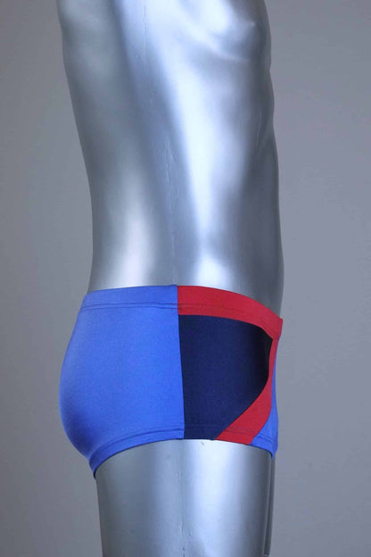 Side view of A pair of SOLAR vintage 80s men's square-cut swim briefs in purple with a red and black diagonal color block shown on a mannequin