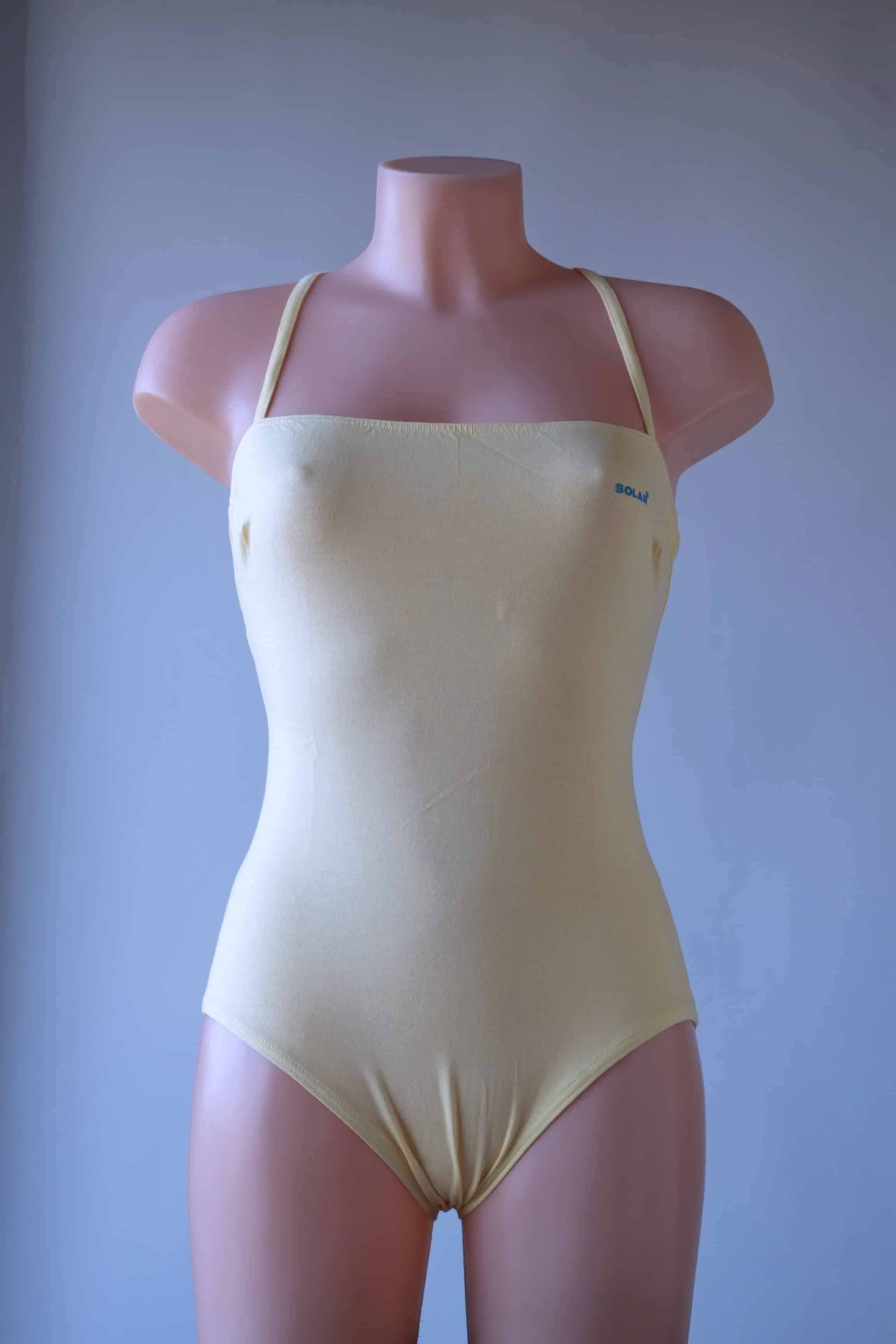 Solar vintage 80s cotton leotard in pale yellow, worn on a mannequin — square neckline with thin spaghetti straps, clean minimal front view