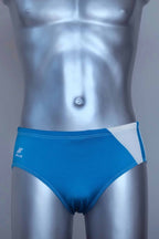 Turquoise men's swim briefs on a silver mannequin against a gray background
