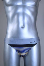 Vintage gray and black striped men's swim briefs with brand logo on a metallic mannequin against a gray background