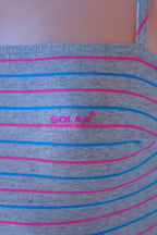 Close-up of Solar vintage 80s pinstripe cotton leotard worn on a mannequin — Solar logo detail on heather grey fabric with fine pink and blue horizontal micro-stripes, strap detail visible