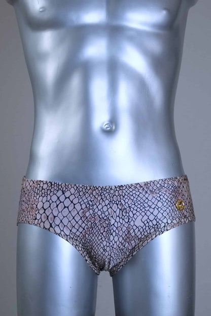 Vintage SOLAR swim briefs with light brown snakeskin print pattern, gold metal logo badge, displayed on mannequin.