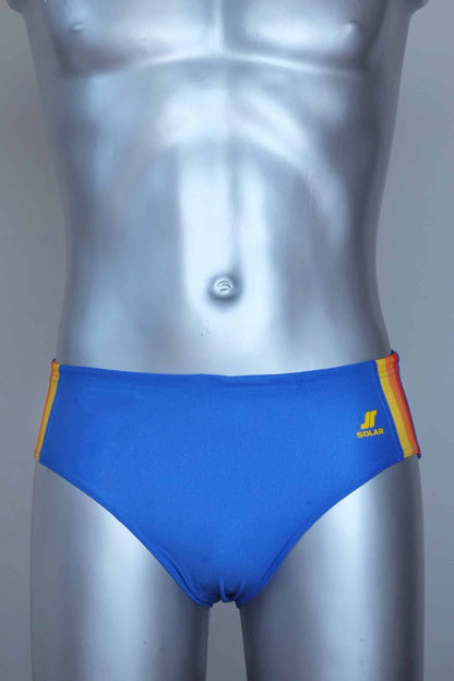 Blue swim brief with colorful side band on a mannequin against a gray background