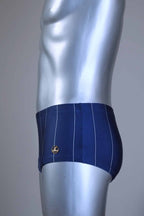 Side view of a Blue pinstripe swim briefs on a mannequin against a gray background