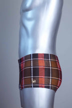 Side view of a Vintage brown plaid patterned swim briefs on a mannequin against a gray background