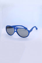 Angled view of vintage 1970s SKILOOK matte cobalt blue shield-style alpine sunglasses with a silver metallic nose bridge accent and gray lenses against a white backdrop.