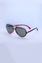 Angled view of vintage 1970s SKILOOK tricolor drop aviator sunglasses with a navy blue frame, red inner rim, white pinstripe accents, and dark grey lenses.