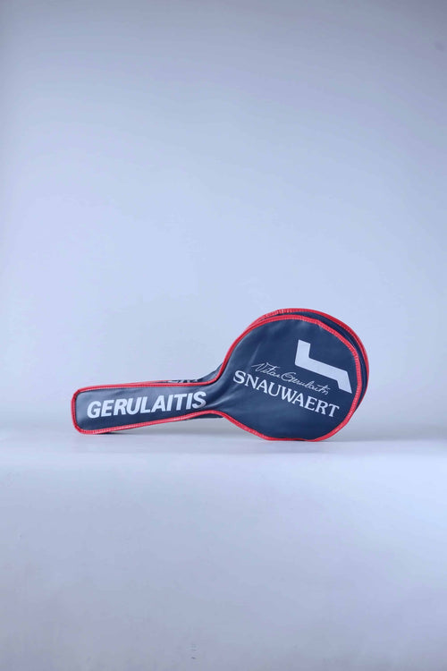 Full view of a white vintage 1980s Snauwaert Vitas Gerulaitis signature tennis racquet zippered head cover with blue and red stripe details.