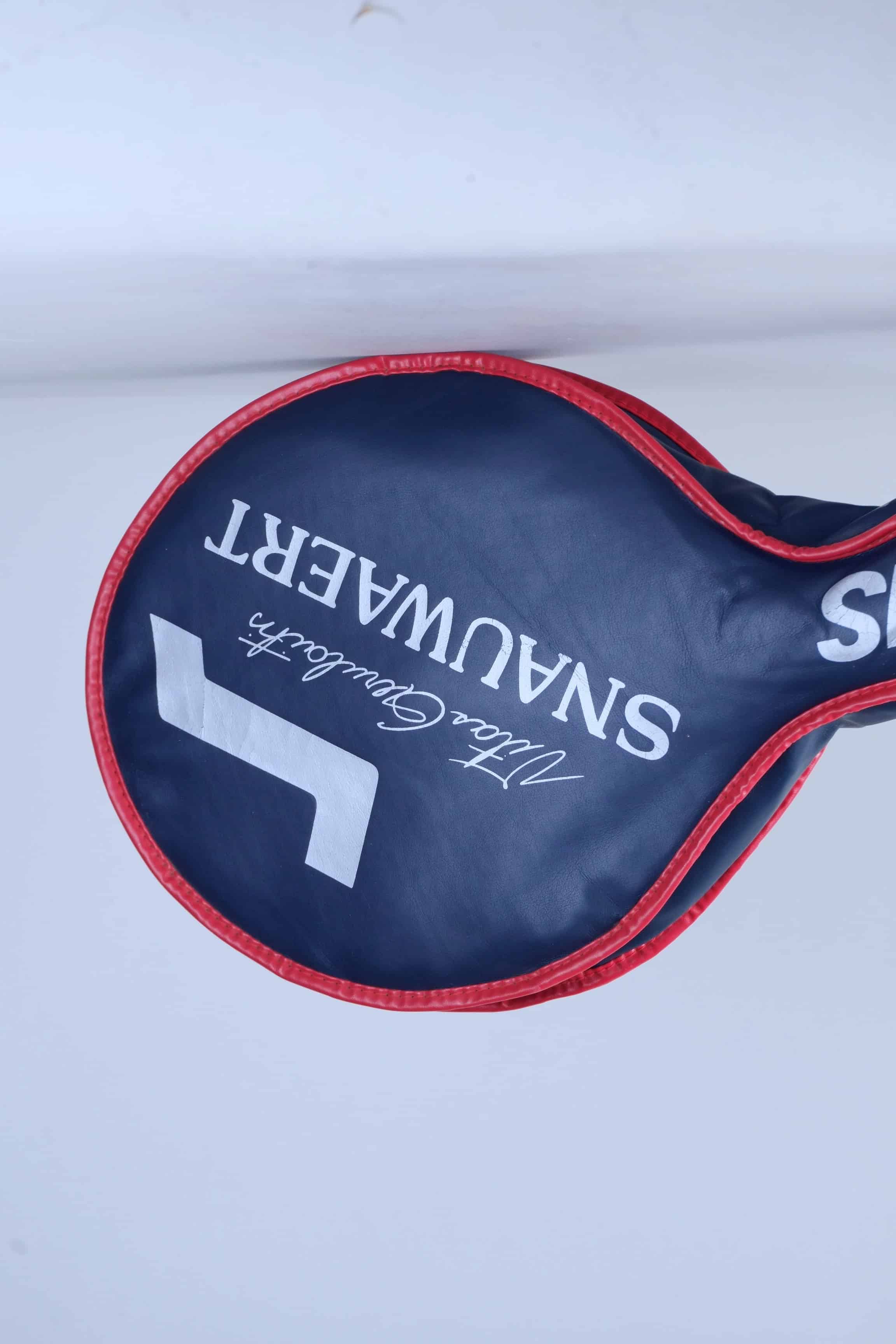 Angled view of the vintage Snauwaert vinyl racquet cover, showcasing the blue printed Vitas Gerulaitis signature text.