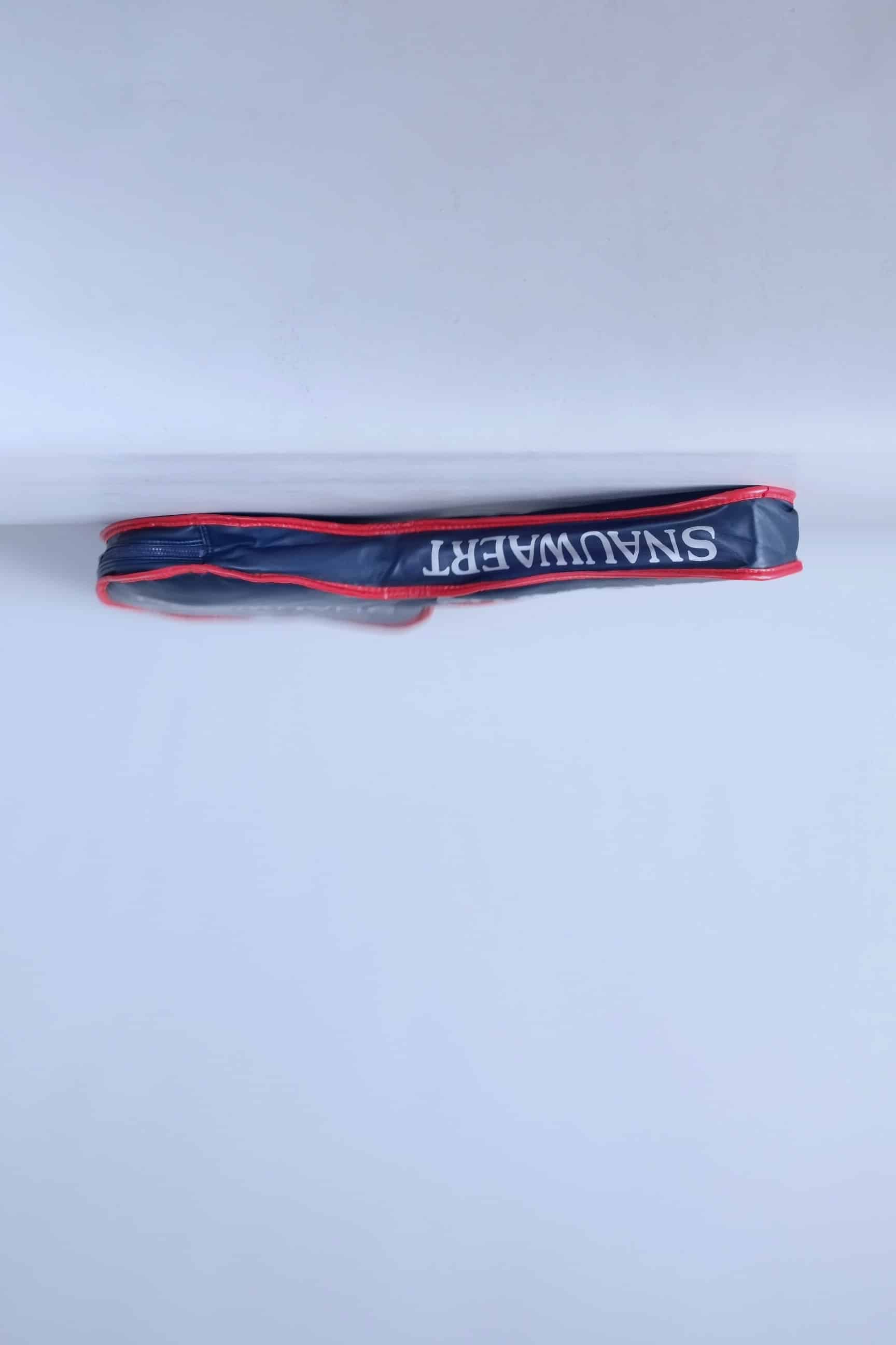 Side profile view of the archival Snauwaert tennis racquet cover, highlighting its slim zippered construction.