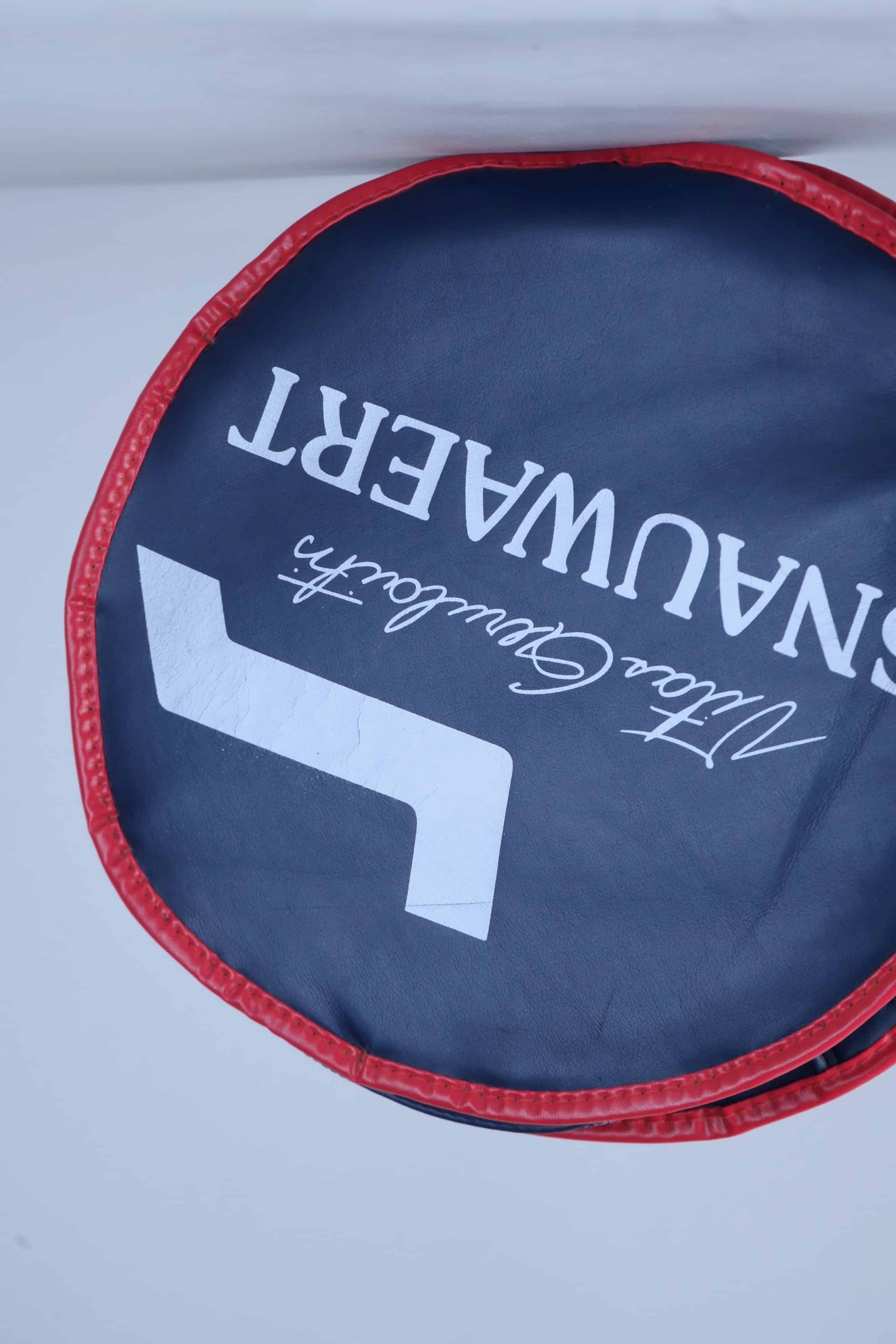Side profile view of the archival Snauwaert tennis racquet cover, highlighting its slim zippered construction.
