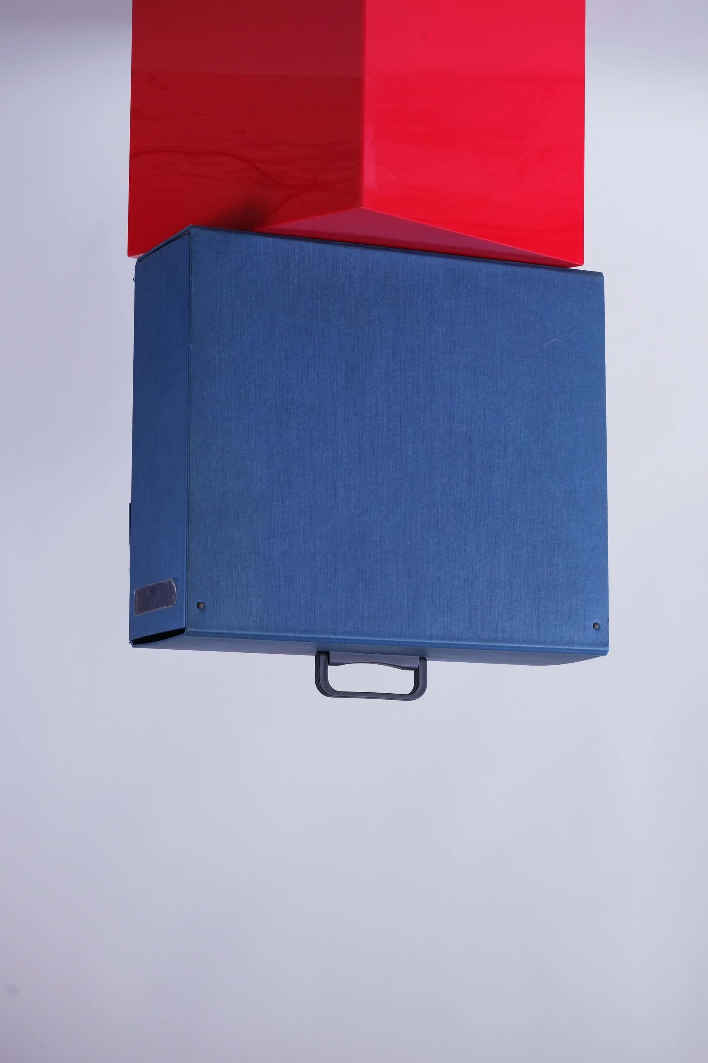 Rear view of the blue Tecnica dealer promo case showing solid back and black handle.