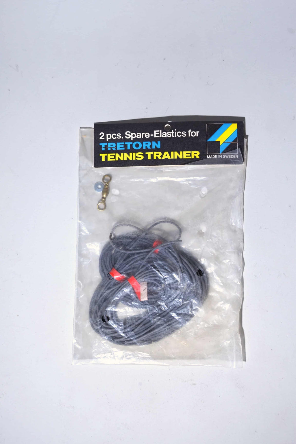 Deadstock vintage Tretorn Tennis Trainer replacement elastic cords in original English retail packaging with included metal swivel clips.