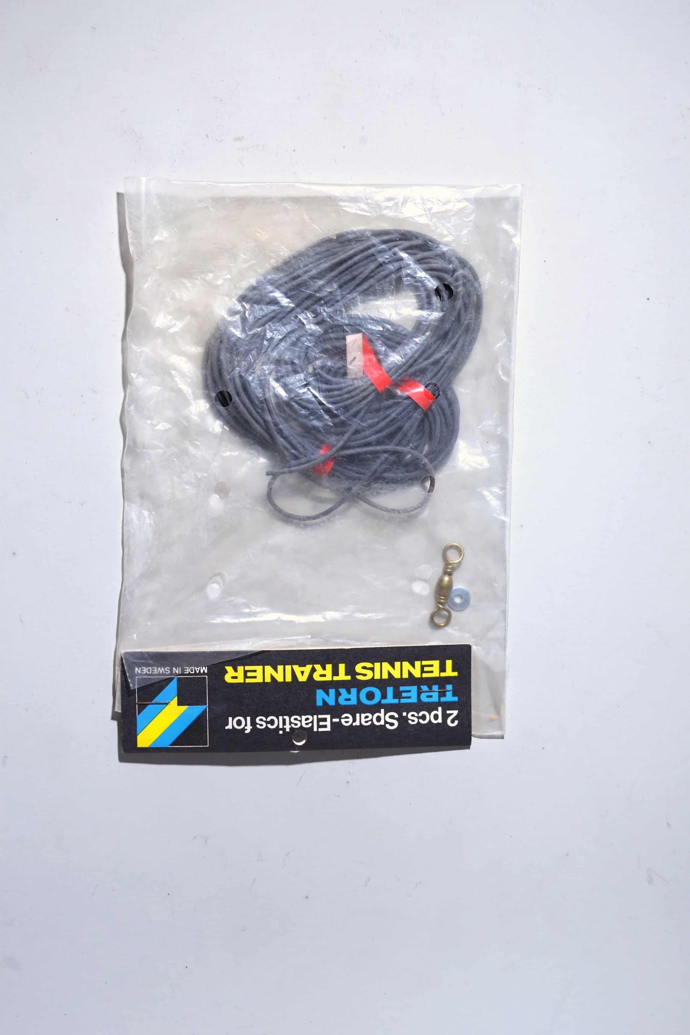 Deadstock vintage Tretorn Tennis Trainer replacement elastic cords in original English retail packaging with included metal swivel clips.
