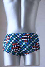 back view of a mannequin wearing a pair of vintage geometric pattern swim briefs