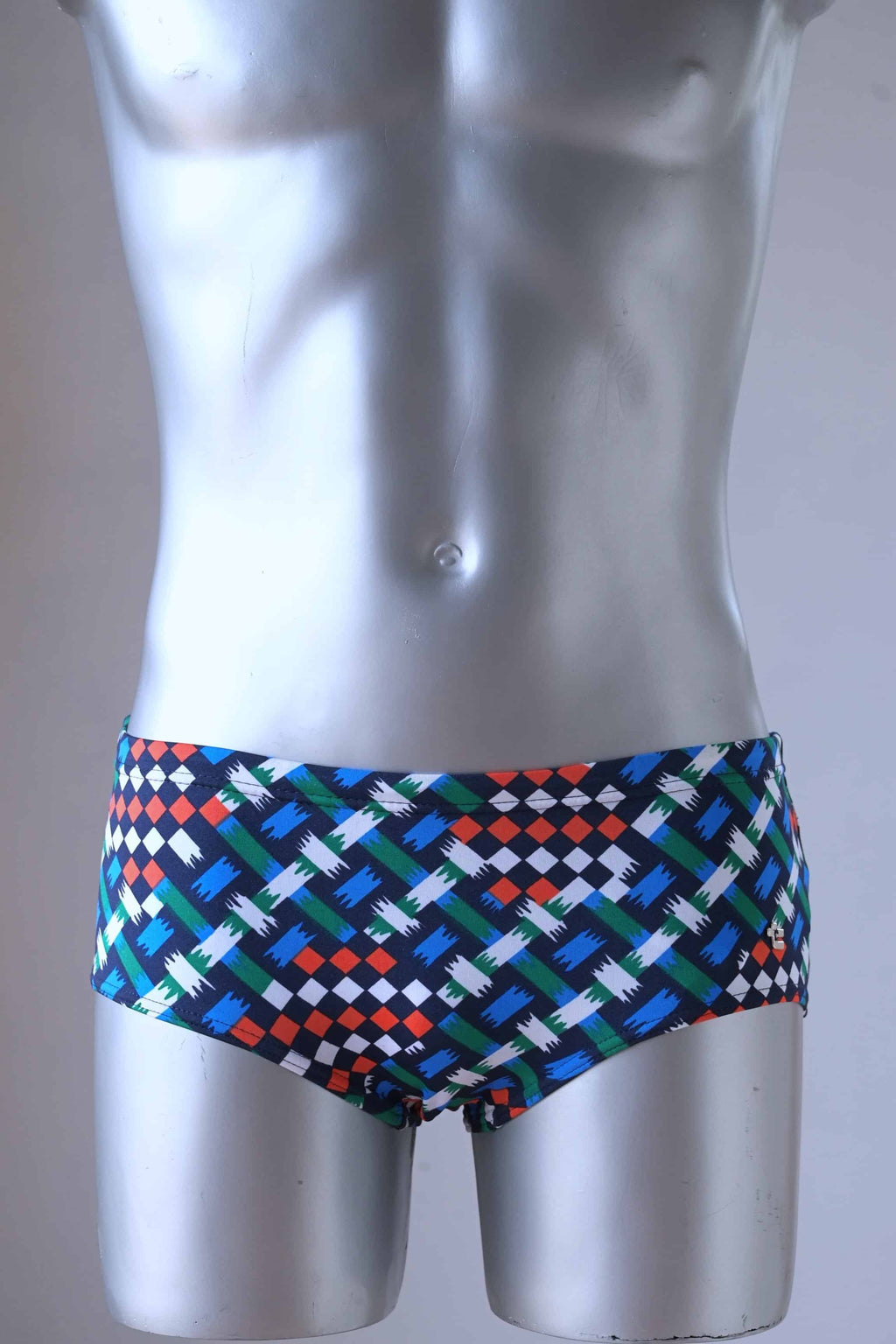 a mannequin wearing a pair of vintage geometric pattern swim briefs