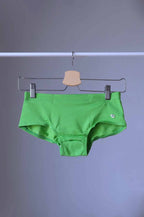 Lime green TROPIC Vintage 70's Swim Briefs on hanger