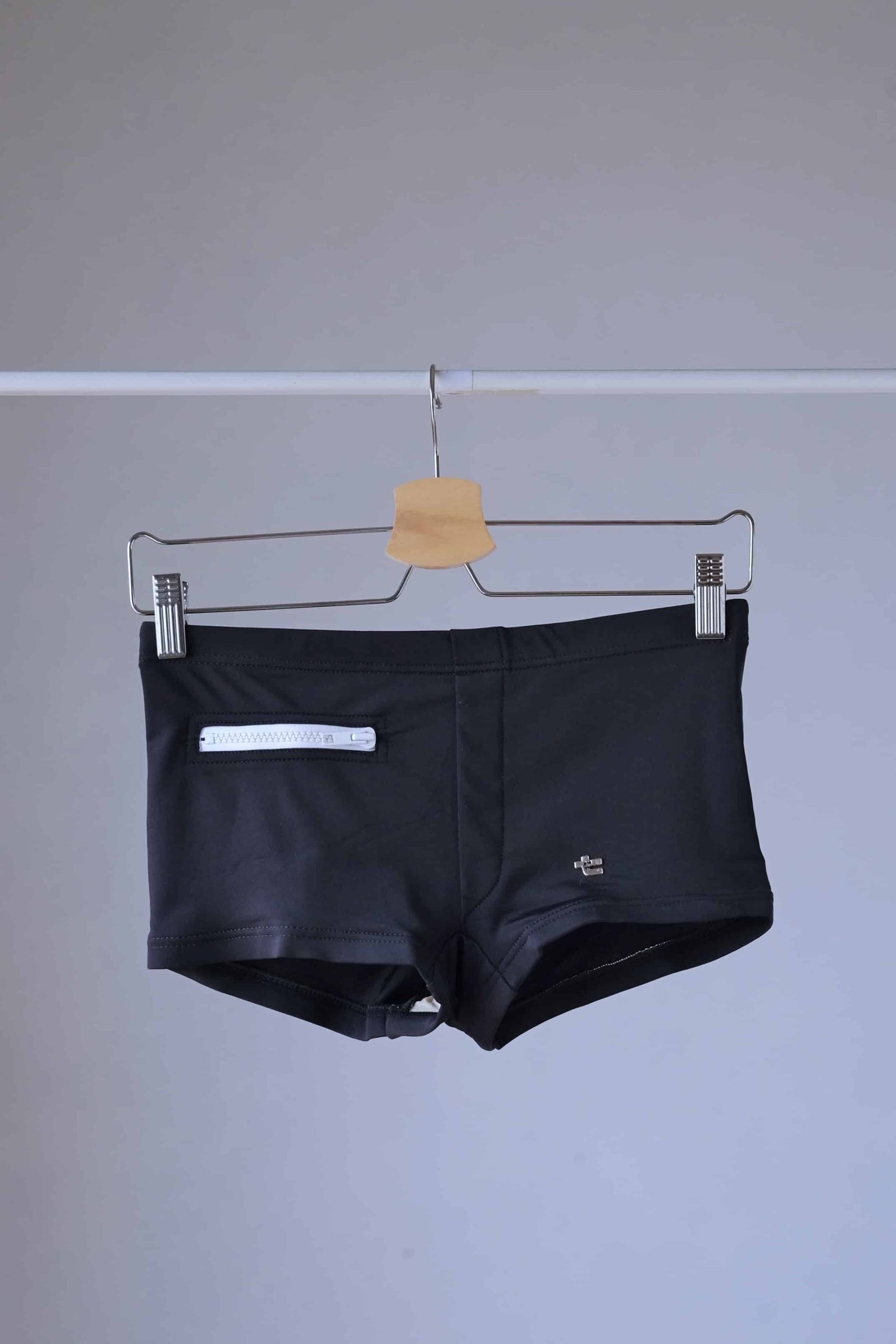 Black Vintage 70's Swim Briefs with Pocket laid on hanger