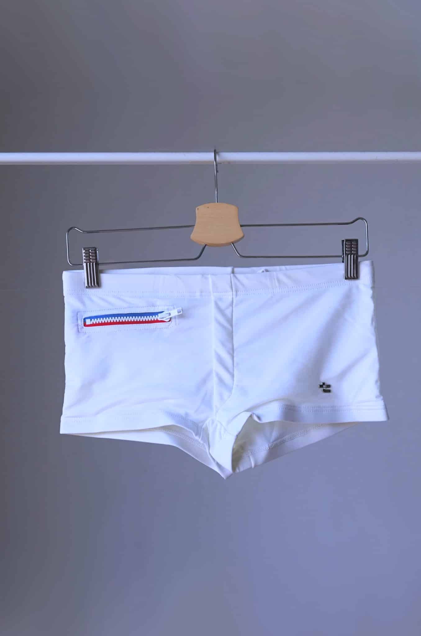 White Vintage 70's Swim Briefs with Pocket laid on hanger