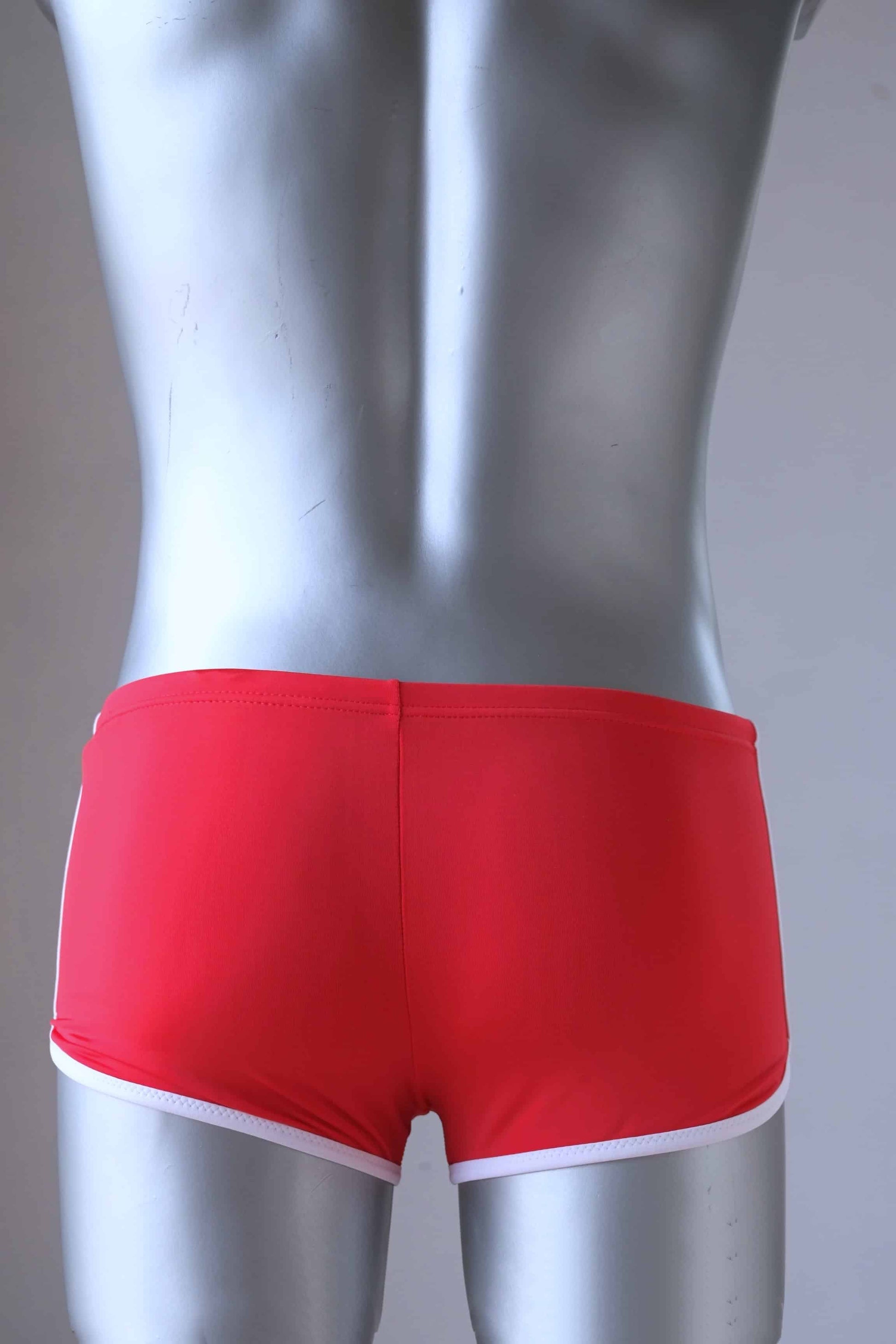 Backside of Vintage red swimming briefs on mannequin