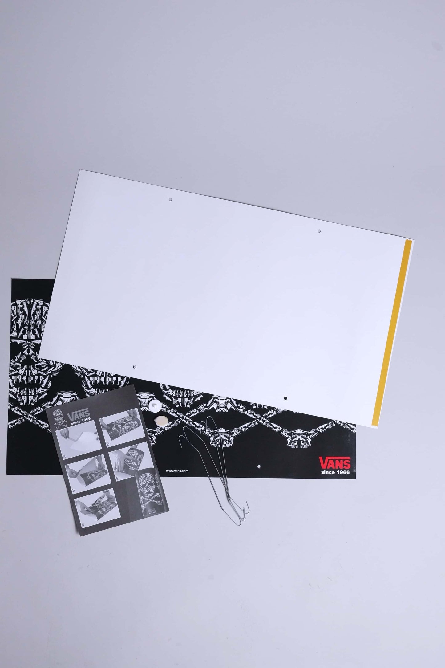 Front and back sheets of VANS 2008 skull mobile display, showing graphics and assembly hardware