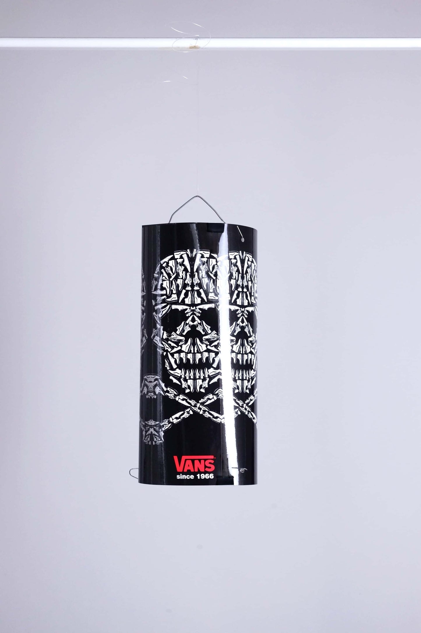VANS skull mobile display fully assembled and suspended, showcasing skull pattern made of sneakers.