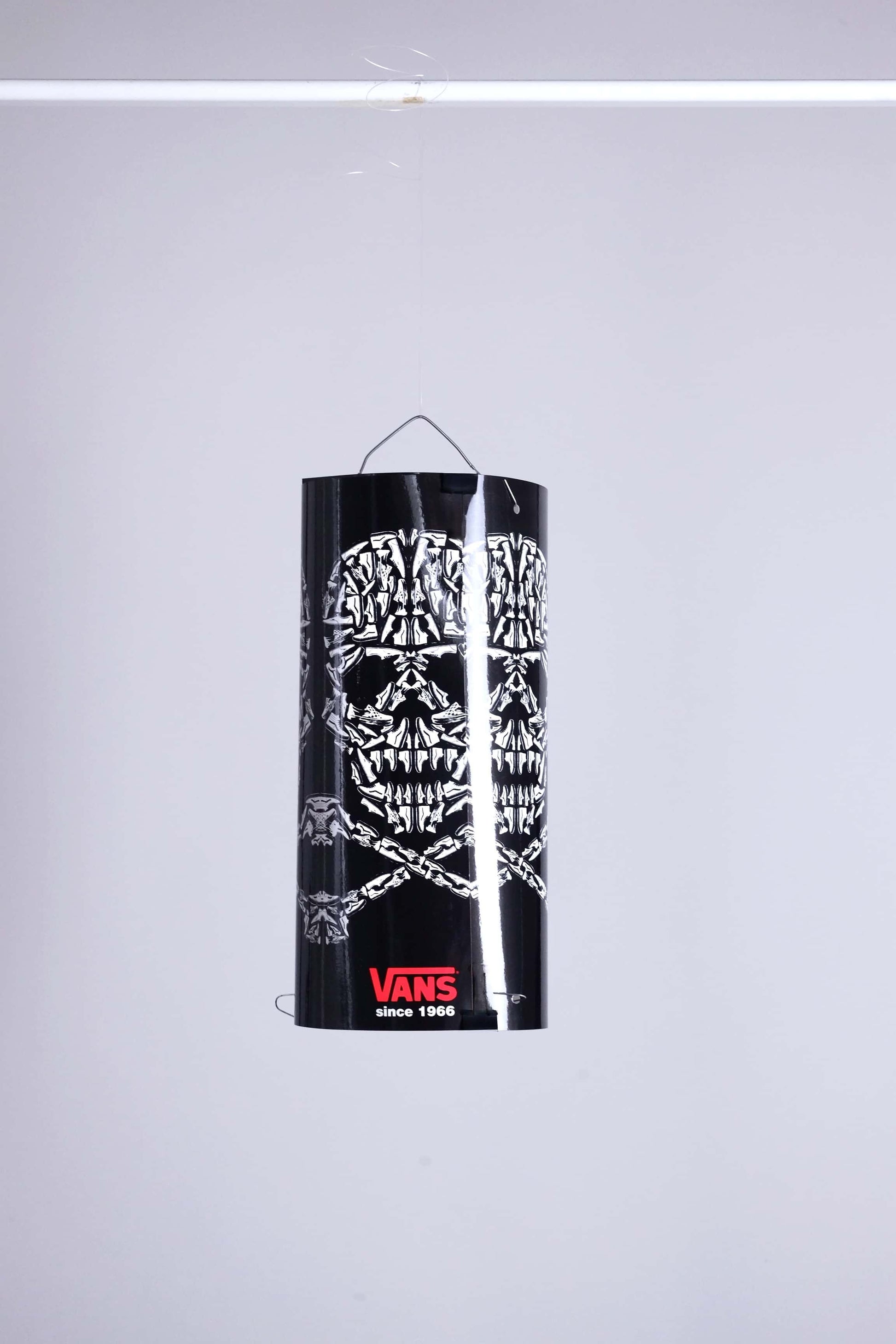 VANS skull mobile display fully assembled and suspended, showcasing skull pattern made of sneakers.
