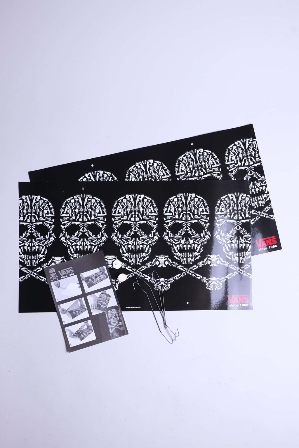 Complete VANS skull mobile set including printed sheets, wires, adhesive tacks, and instructions.