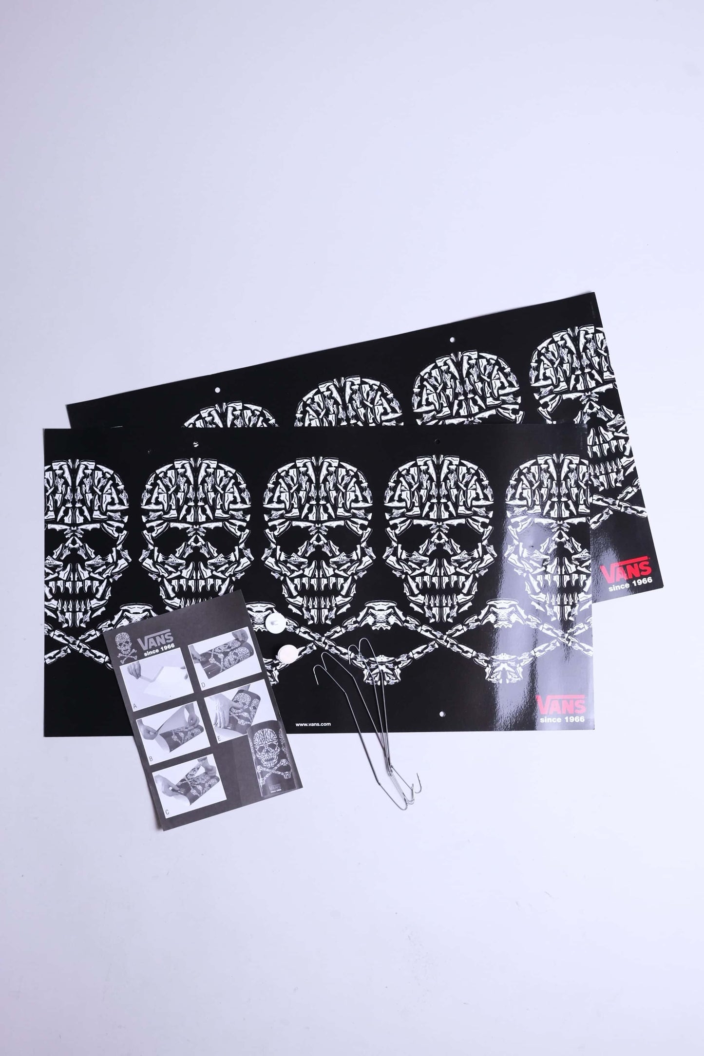 Complete VANS skull mobile set including printed sheets, wires, adhesive tacks, and instructions.