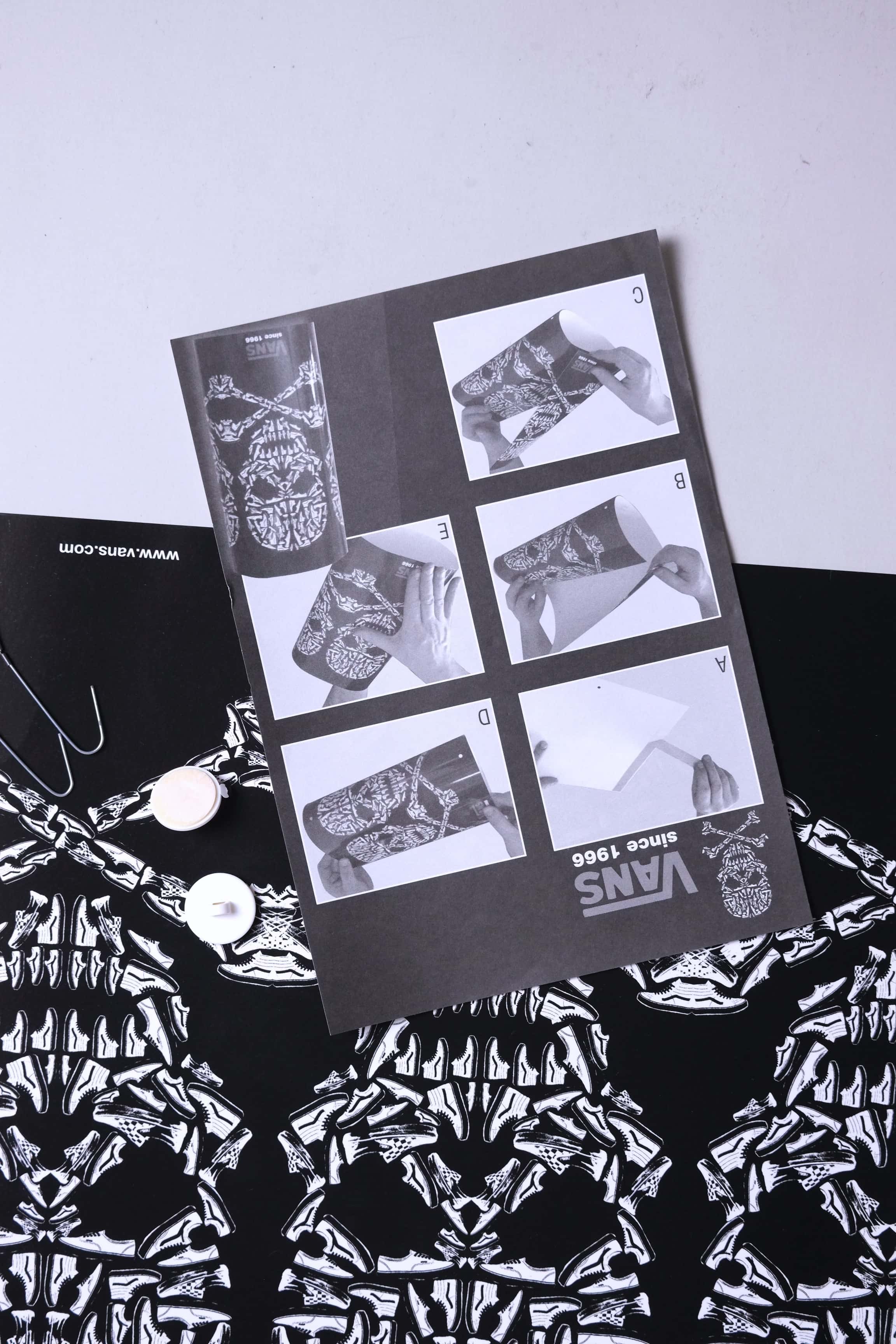 Detailed view of VANS 2008 skull mobile instruction manual and printed skull artwork.