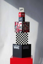 Front view of full VANS vintage dealer display set featuring 6 stacked cubes with red, black, and white branding, checkerboard, and graphic art.