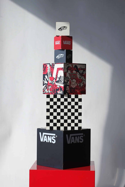 Front view of full VANS vintage dealer display set featuring 6 stacked cubes with red, black, and white branding, checkerboard, and graphic art.