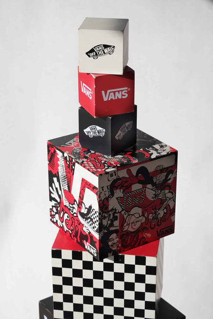 Tight shot of VANS cube stack focusing on graffiti artwork and iconic branding, highlighting color and detail.