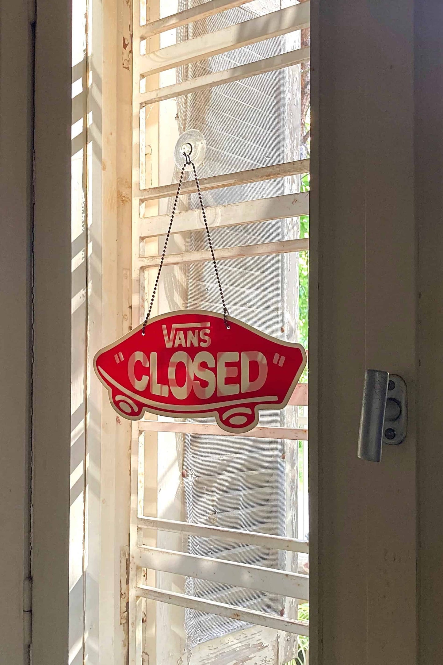VANS Open/Closed Door Sign on a window
