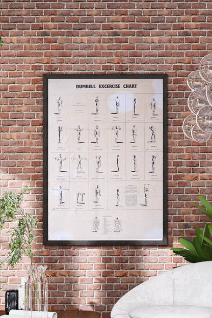 Vintage 1970s dumbbell exercise chart in black frame on red brick wall – retro gym poster home décor mockup.