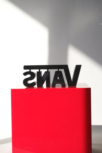 Rear view of the Vans Y2K 3D logo store display sign showing the structure and clean block lettering from behind.