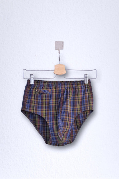 Front view of a vintage late 1950s to early 1960s men's swim brief on a hanger. The brief features a plaid pattern in dark brown, blue, and yellow tones, with a small front flap pocket.