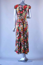 Back view of vintage 90s floral maxi dress on mannequin showing corset lace-up waist detail