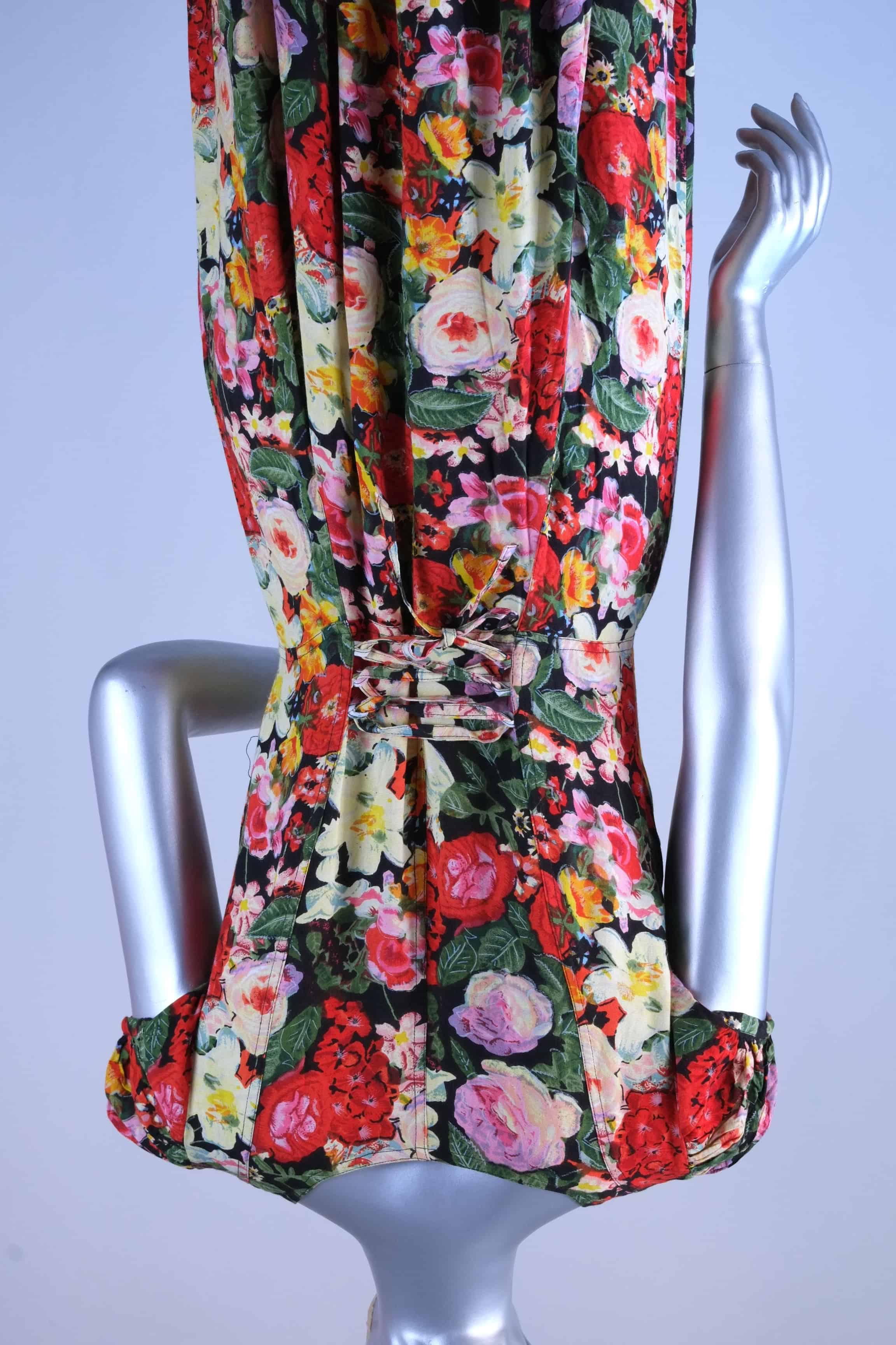 Close-up of corset-style lace-up waist tie on vintage 90s floral maxi dress