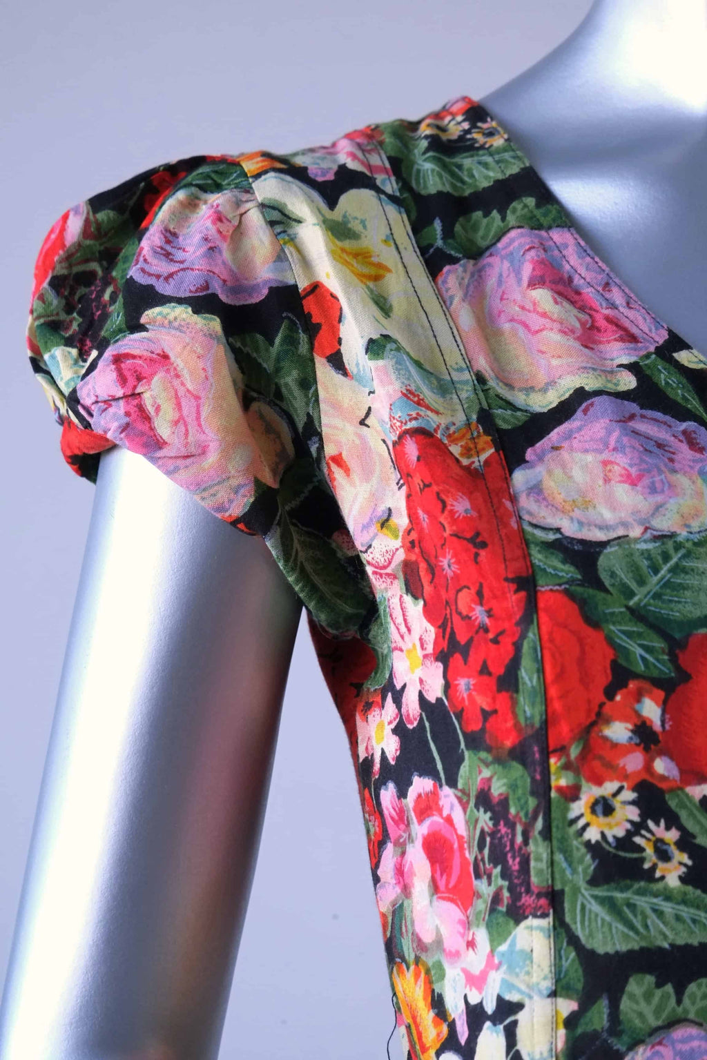 Close-up of cap sleeve and shoulder seam on vintage 90s rose floral maxi dress