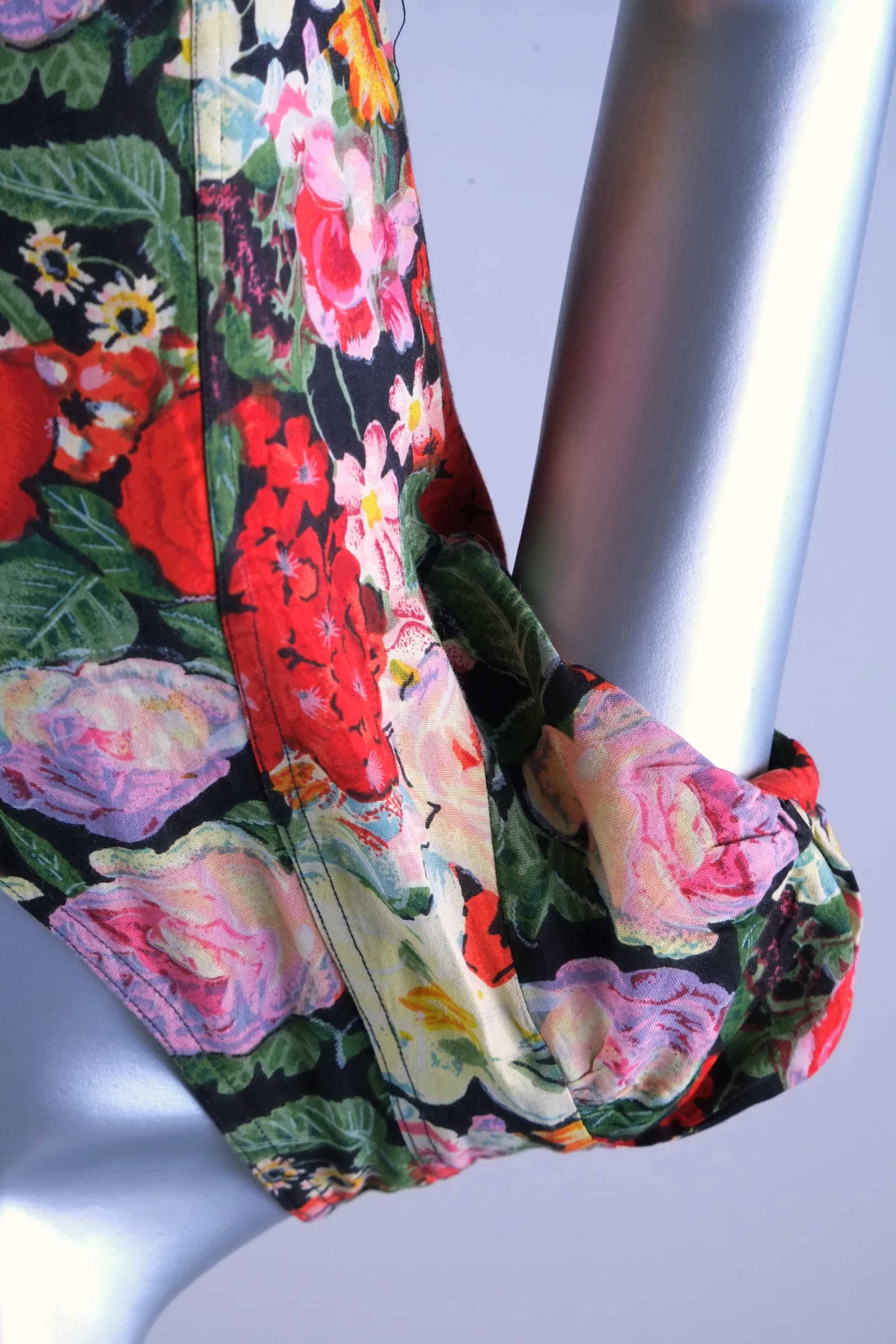 Close-up of cap sleeve and shoulder seam on vintage 90s rose floral maxi dress
