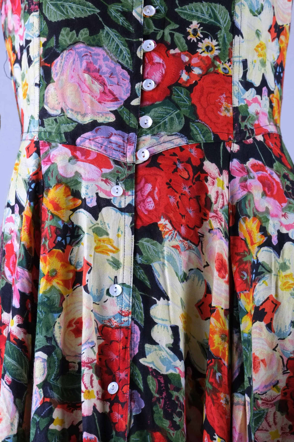 Close-up of button placket and seaming at waist on vintage 90s floral maxi dress