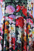 Close-up of button placket and seaming at waist on vintage 90s floral maxi dress