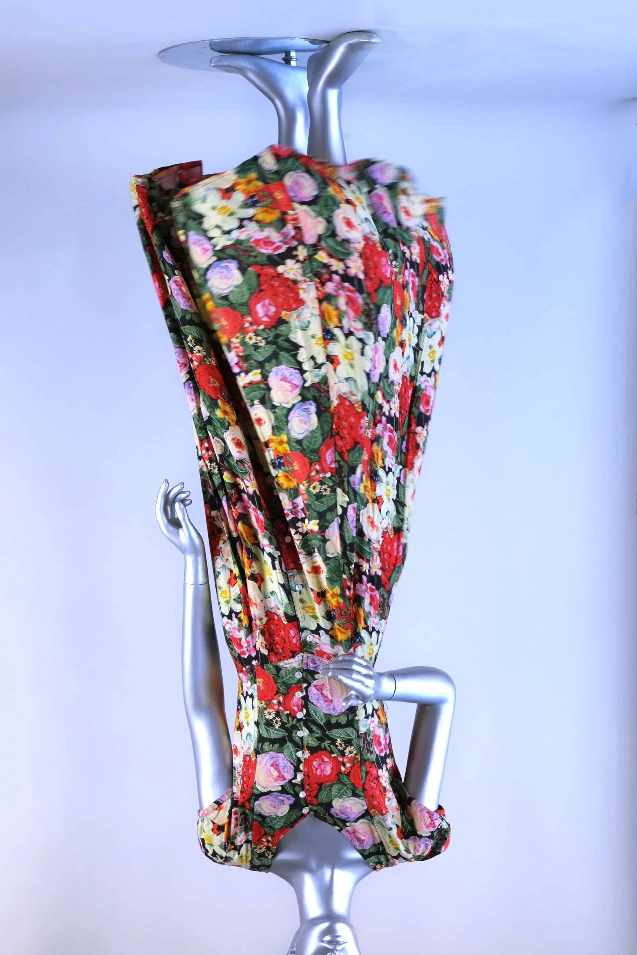 Front view of vintage 90s floral maxi dress on mannequin showing cap sleeves and flowing skirt