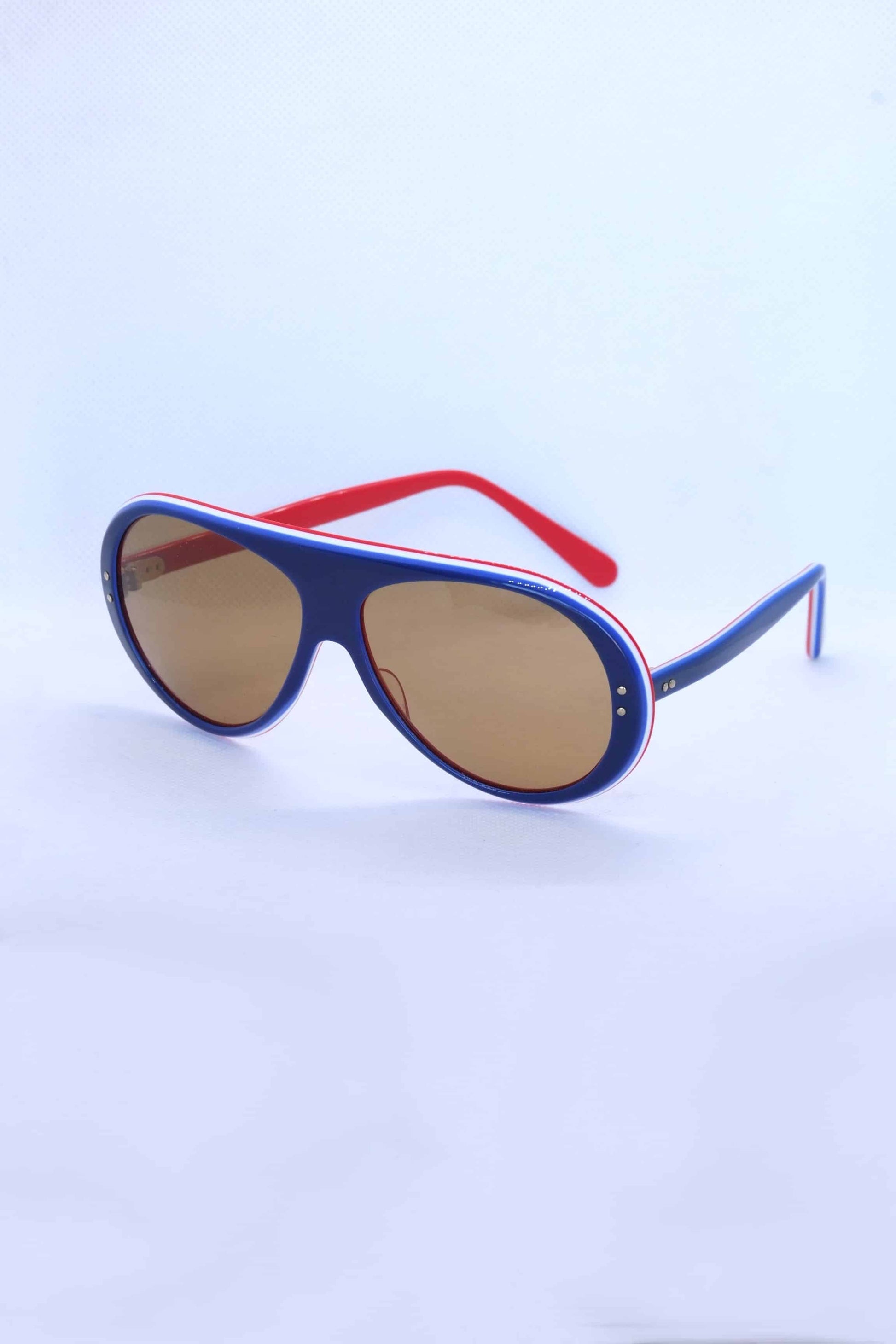Vintage 70's Rally Coq Sunglasses in blue on white background
